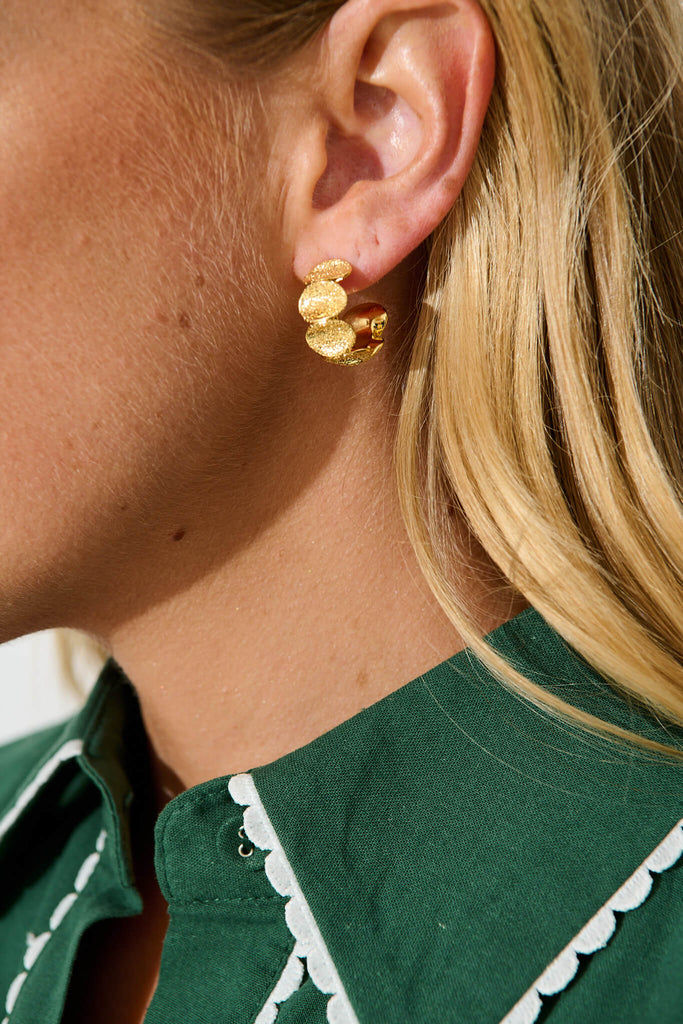 Juliana Textured Circle Hoop Earrings in Gold on model side detail